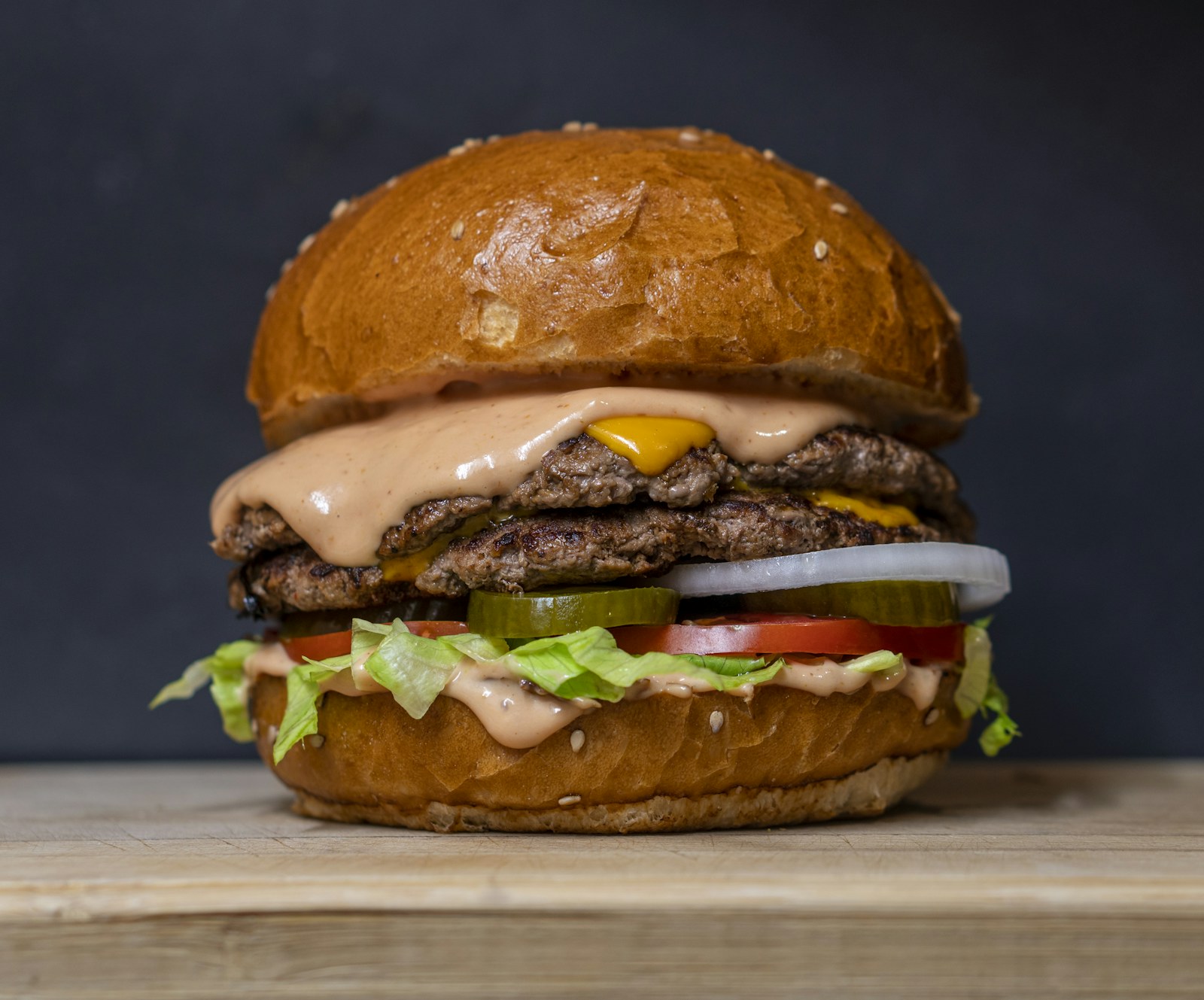 Double cheeseburger with fries and a beer